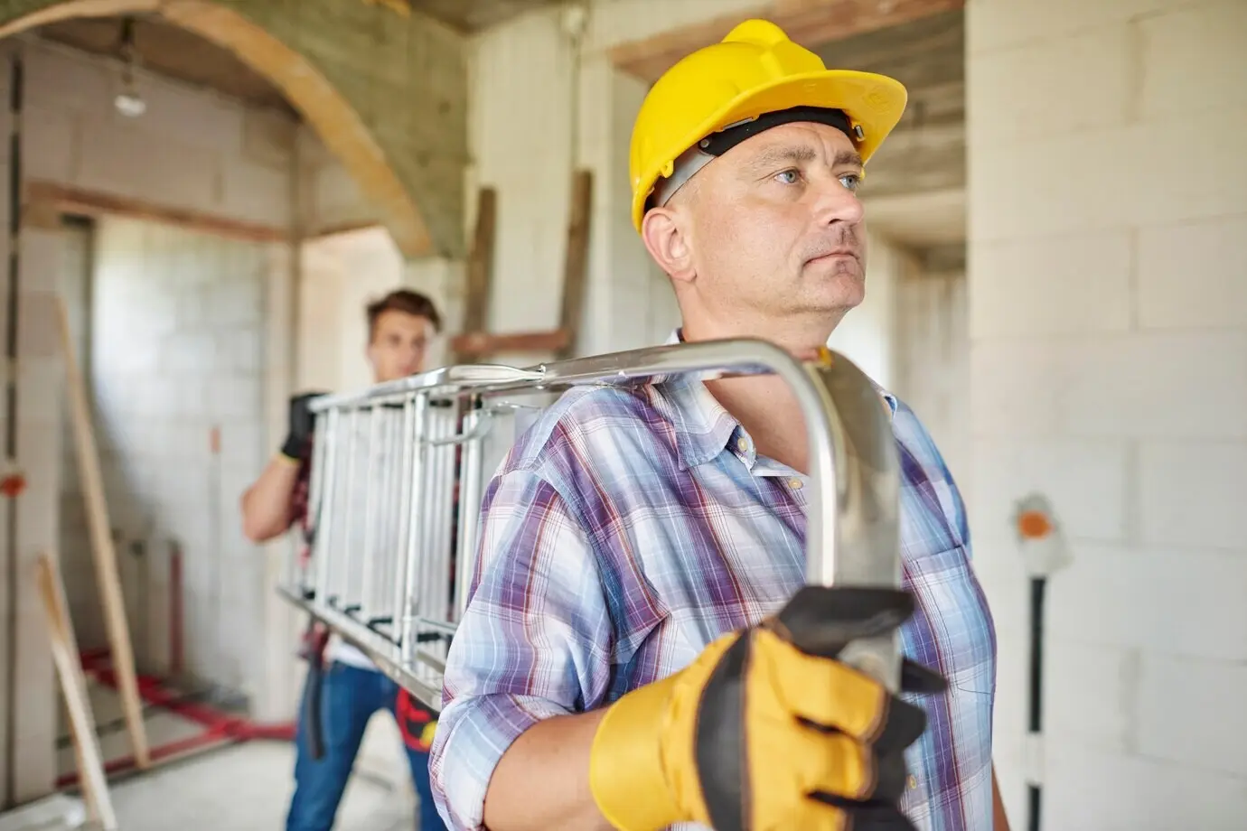 Close-up of an experienced carpenter in his workshop.